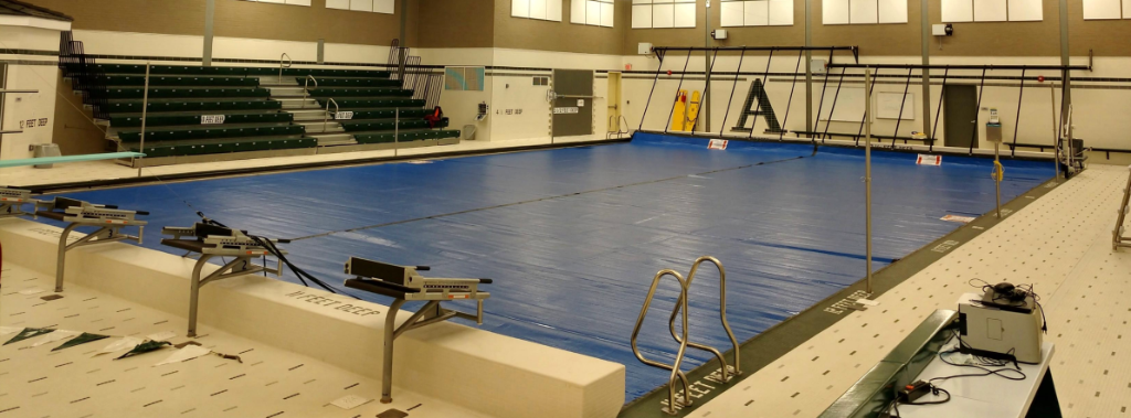 Indoor Municipal Natatorium with Full Blue Spectrum Thermal Blanket